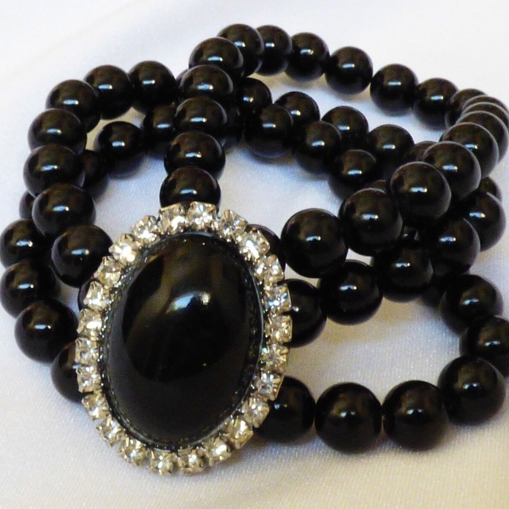 Silver tone metal oval center bar 3 row strands black beads stretched bracelet